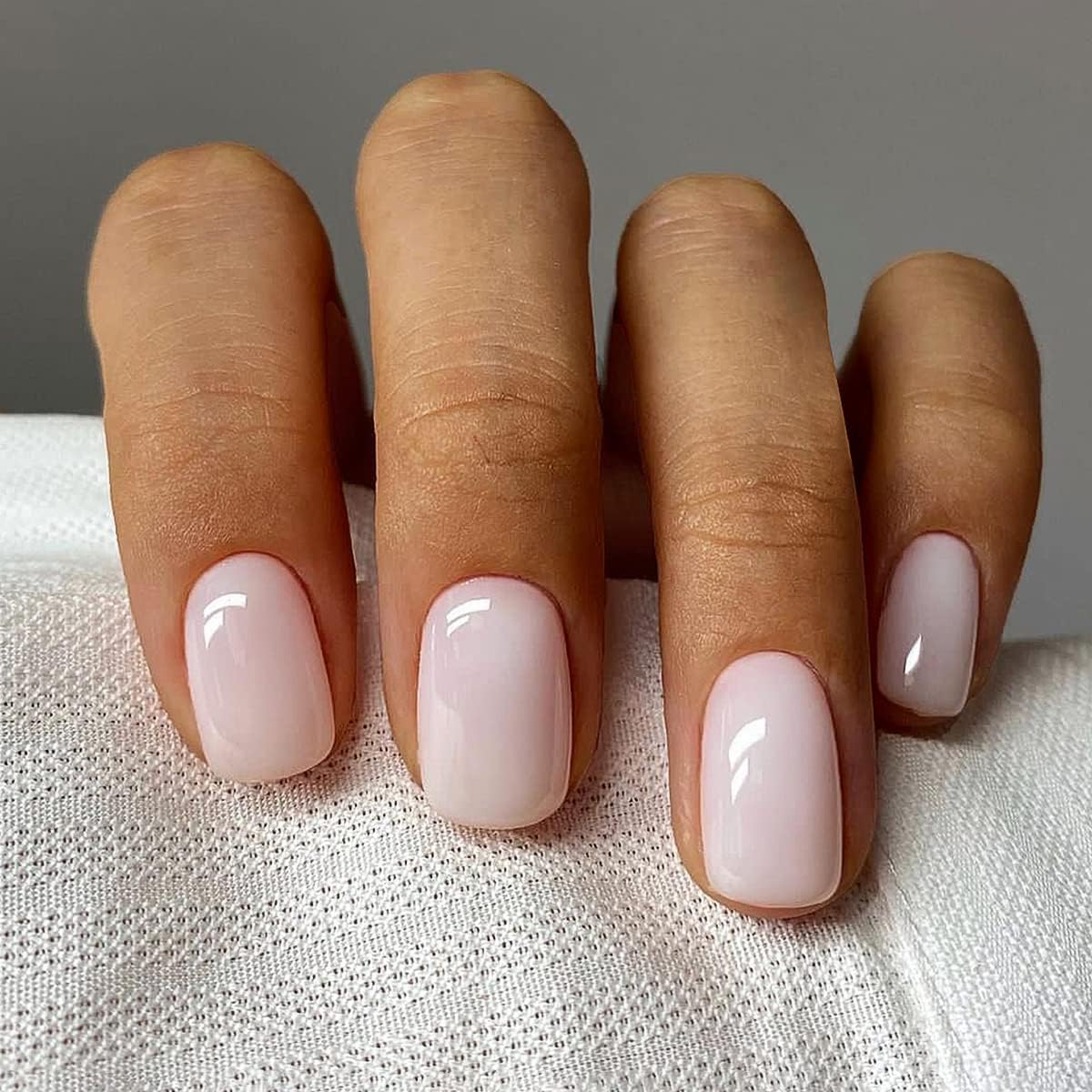 Curvlife Press on Nails Milky White Short Square Acrylic Fake Nails with Apricot Design Full Cover Glossy Nude Glue on Nails Artificial for Women 30Pcs